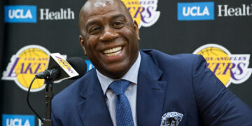 Details on Magic Johnson's share in the Washington Commanders sale.